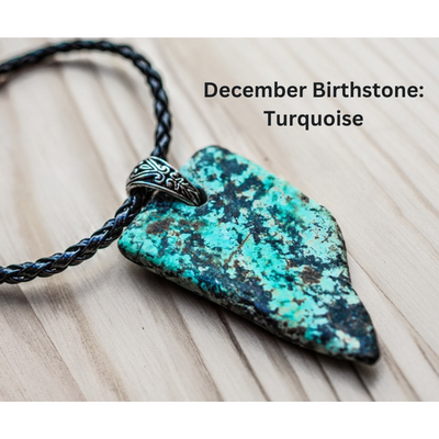 Elegant turquoise pendant, the December birthstone, on a braided leather cord, against a wooden backdrop.